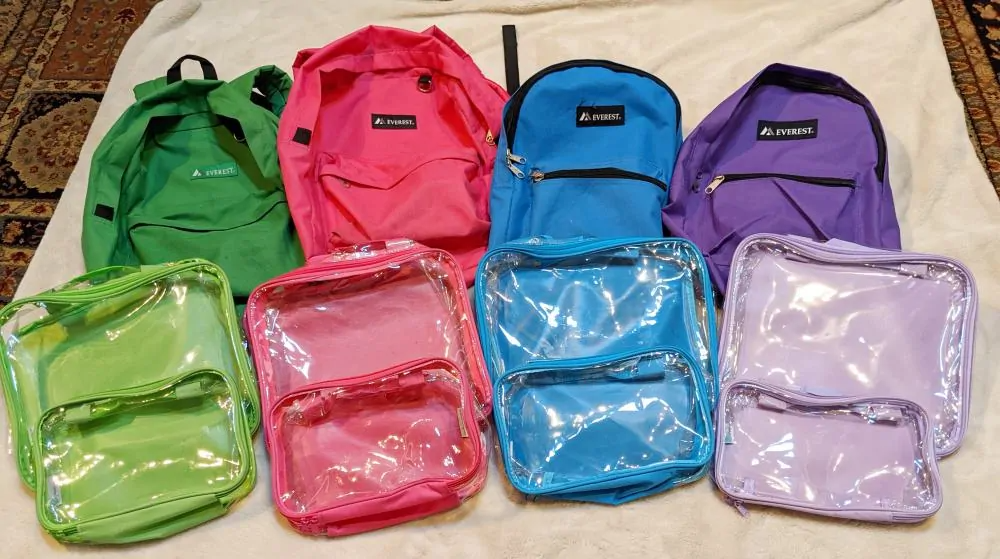 Clear packing cubes and backpacks with matching colors