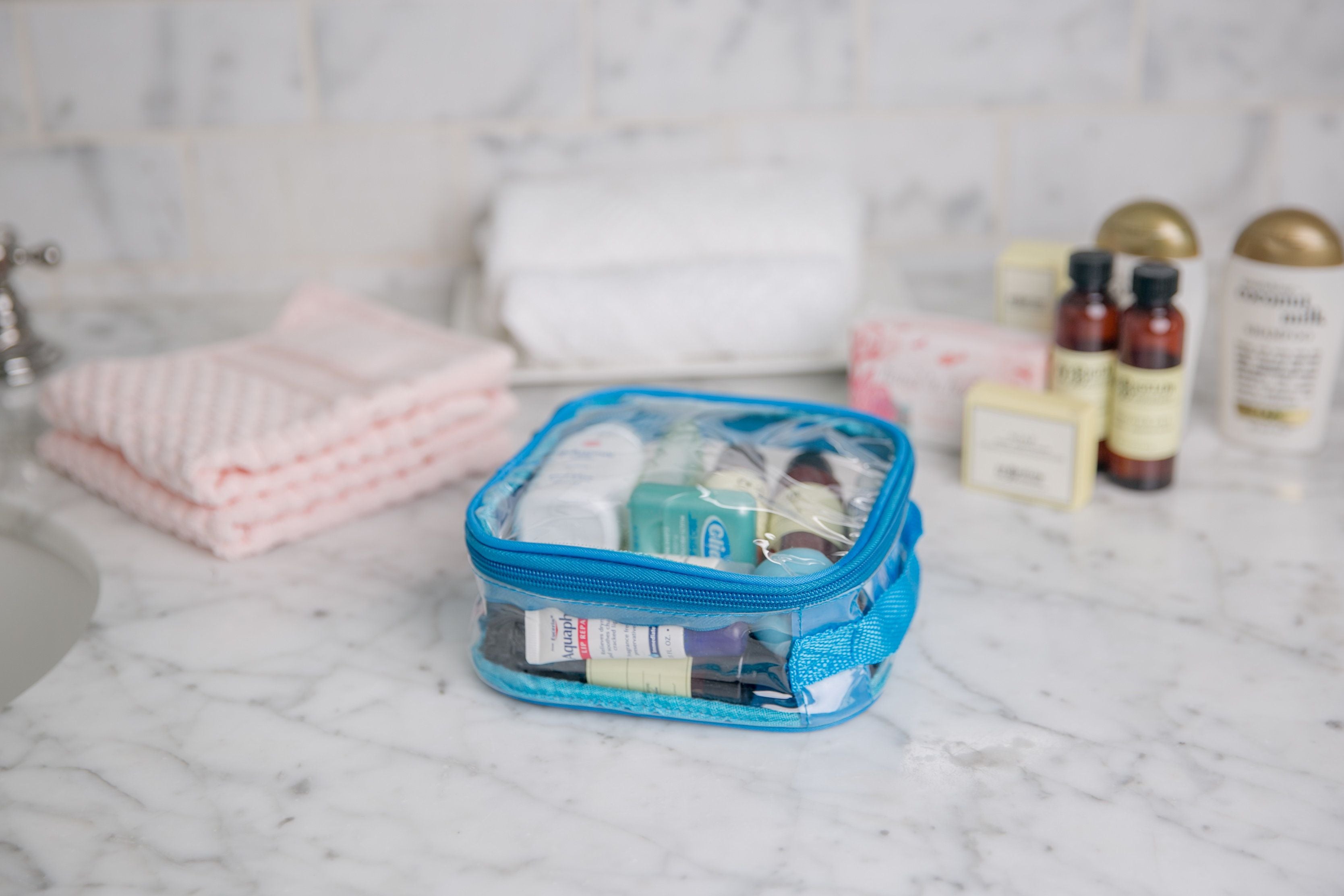 Toiletries packed inside turquoise quart size bag