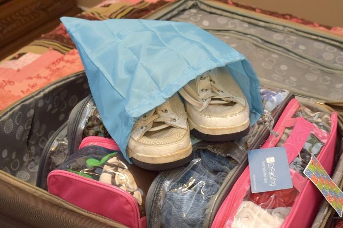 Sneakers inside a travel shoe bag