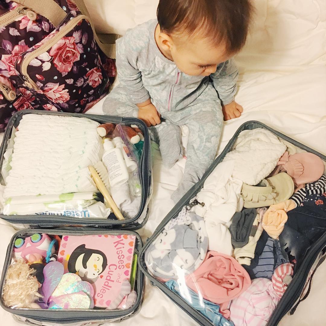 baby's travel essentials in packing cubes