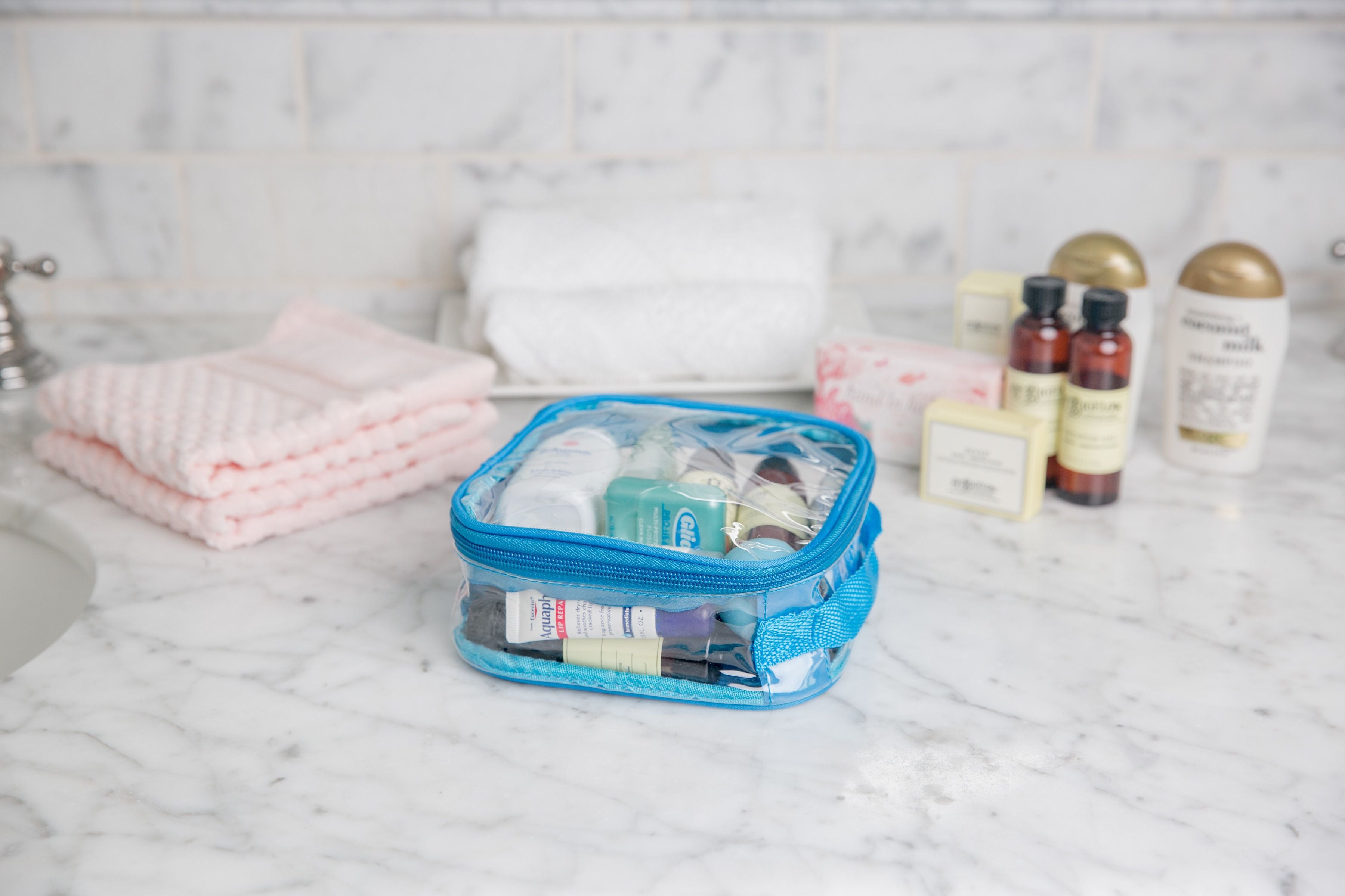 toiletries in a turquoise extra small cube