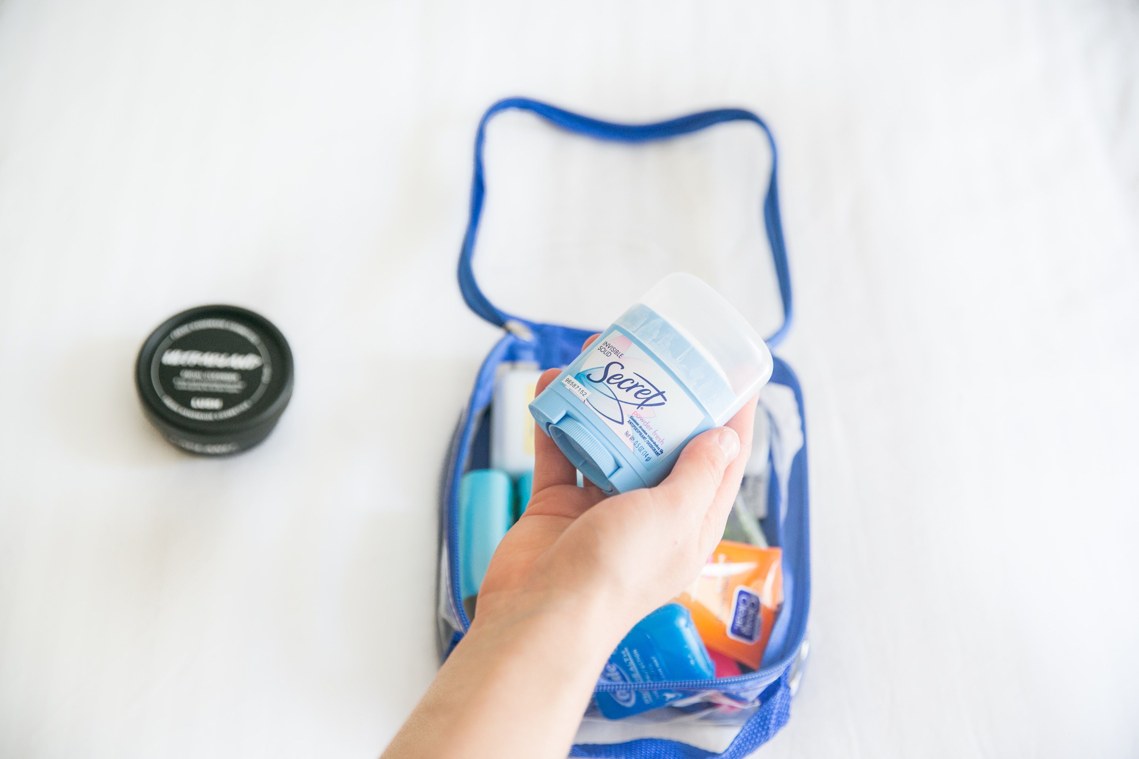 deodorant and other toiletries in an extra small cube