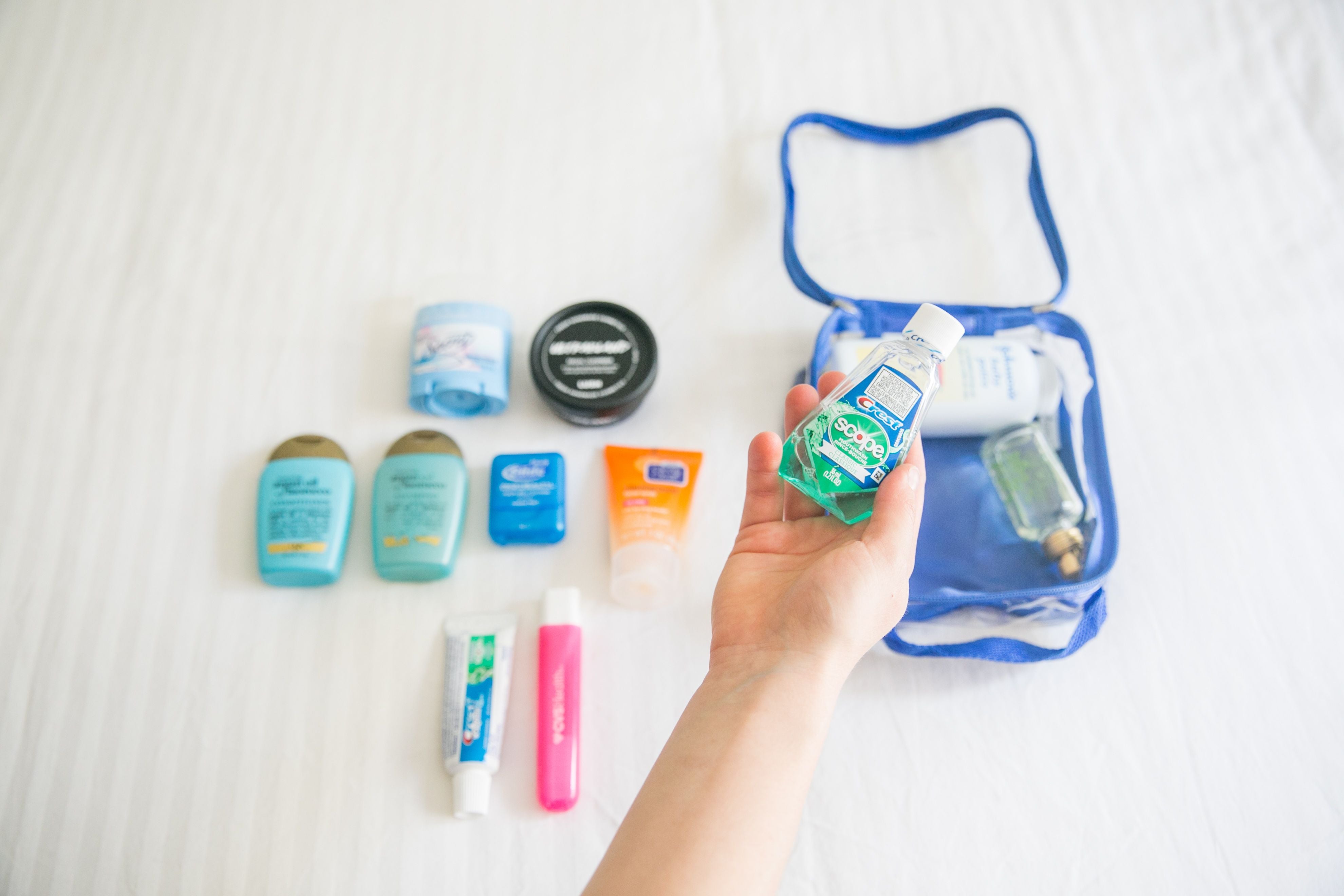 travel size mouthwash and other toiletries in an extra small cube