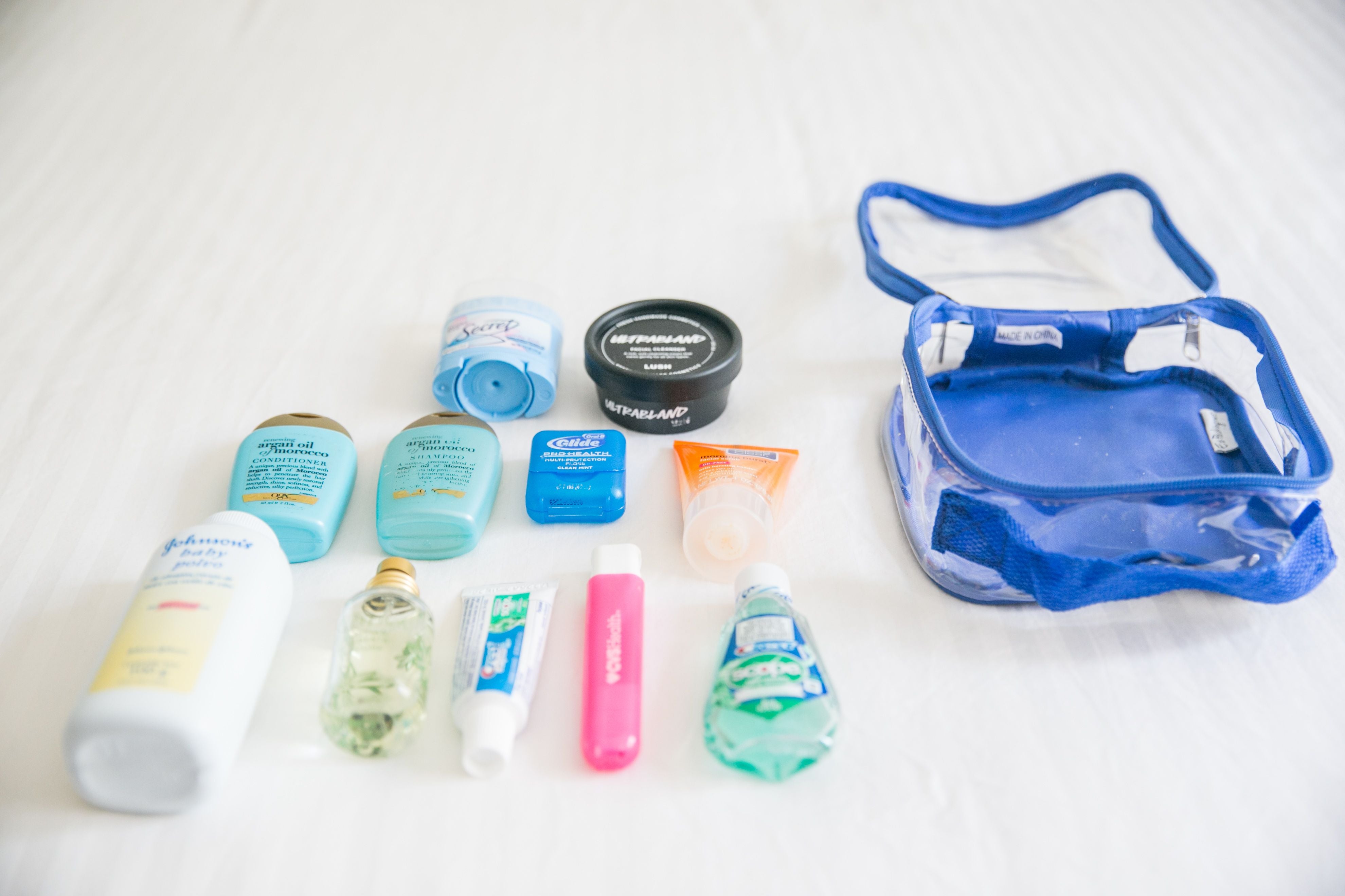 travel size bottles and a royal blue extra small cube