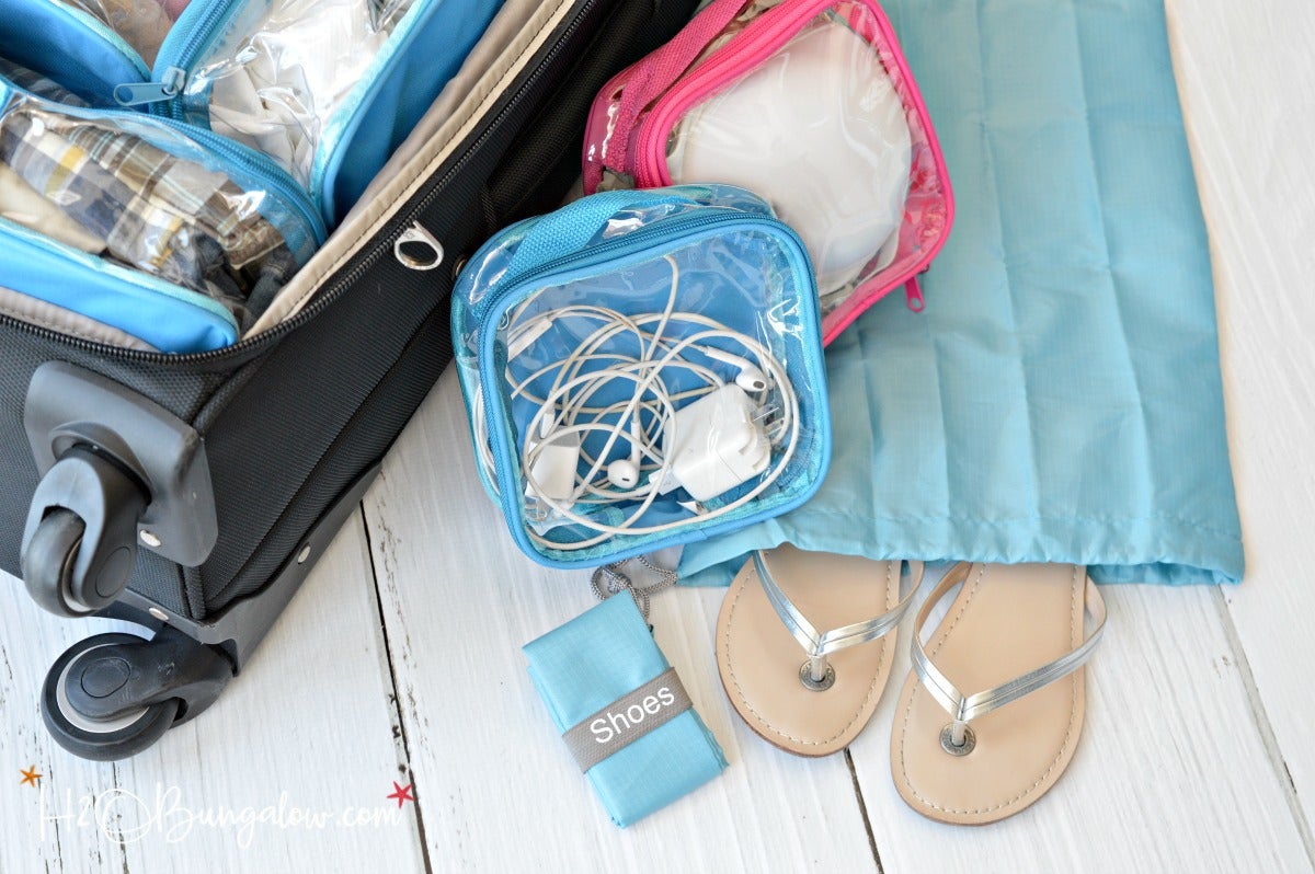 Organizing essentials using clear cubes and travel shoe bag