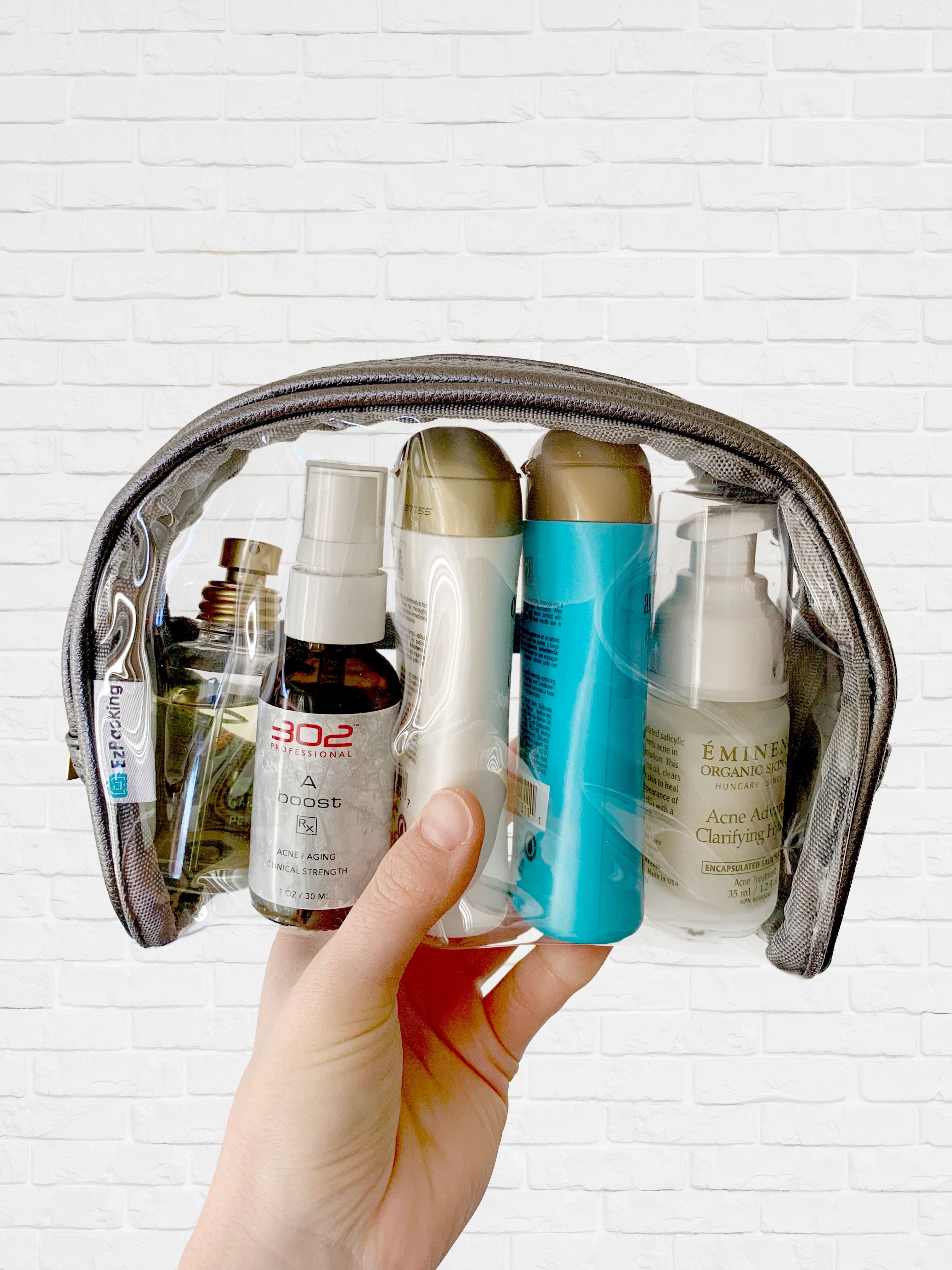 Toiletry in a clear half moon pouch