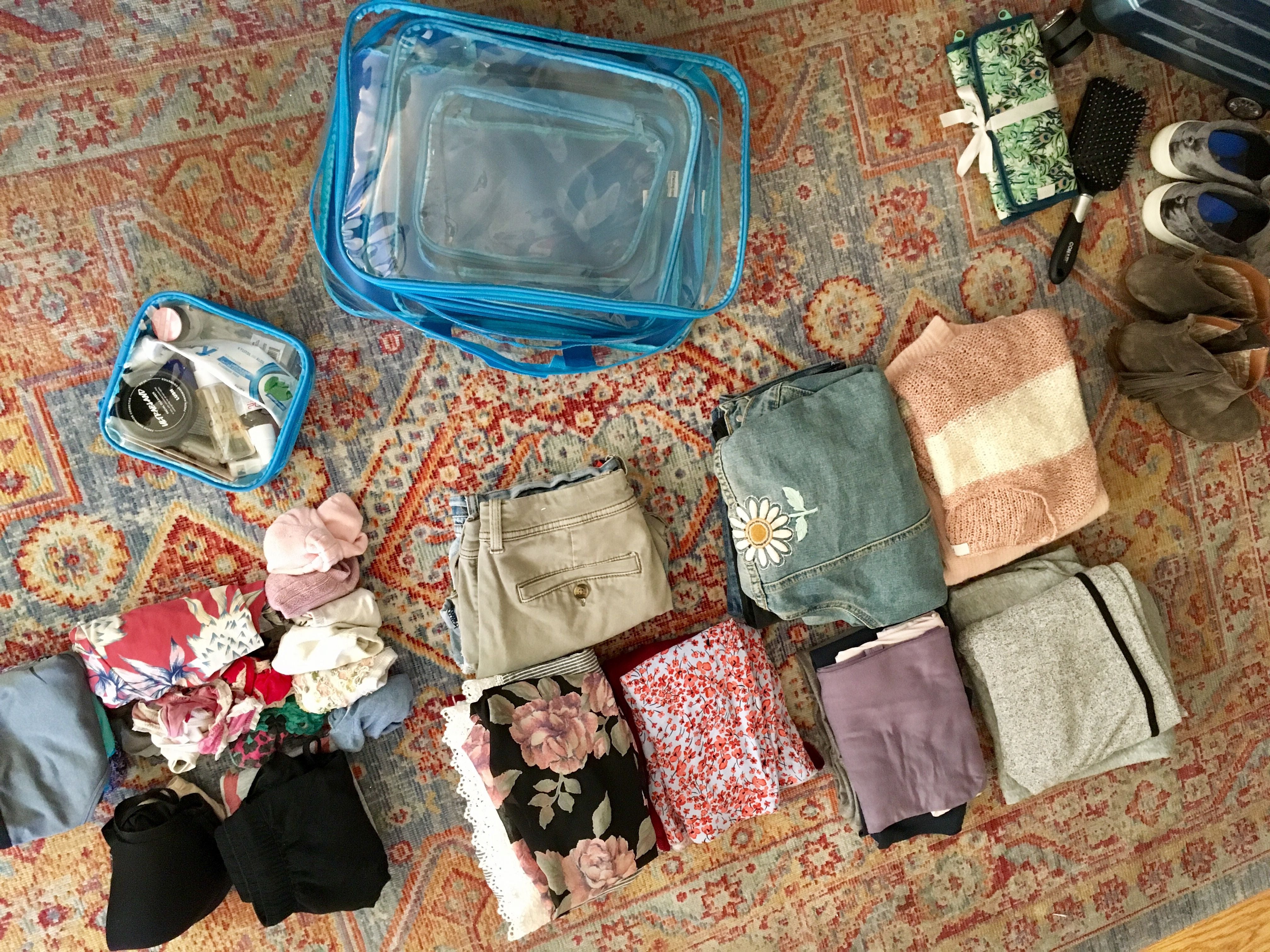 Packing folded and laid out clothes for a three-day trip