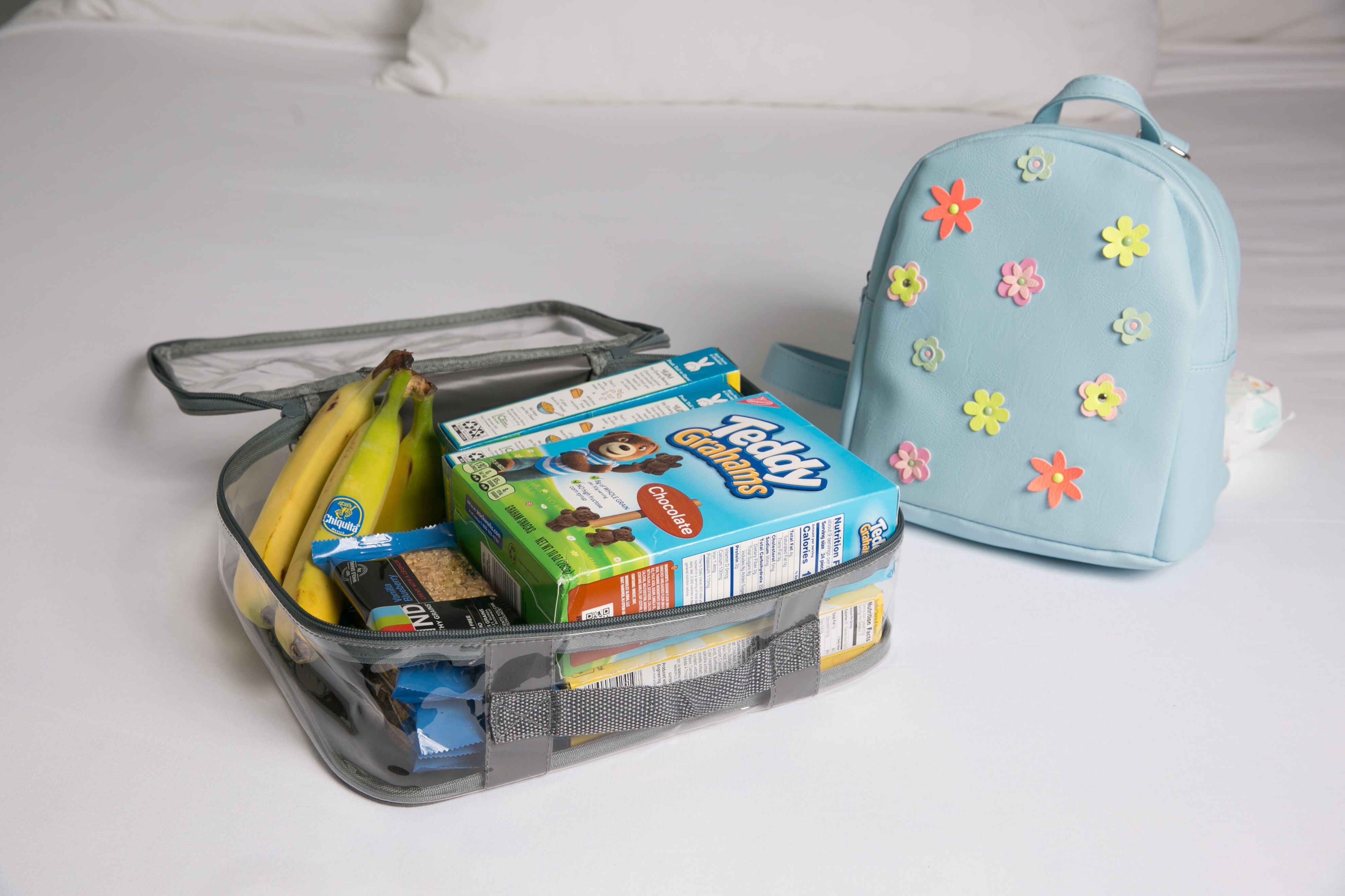 Kids snacks for backpacking trip in a clear packing cube