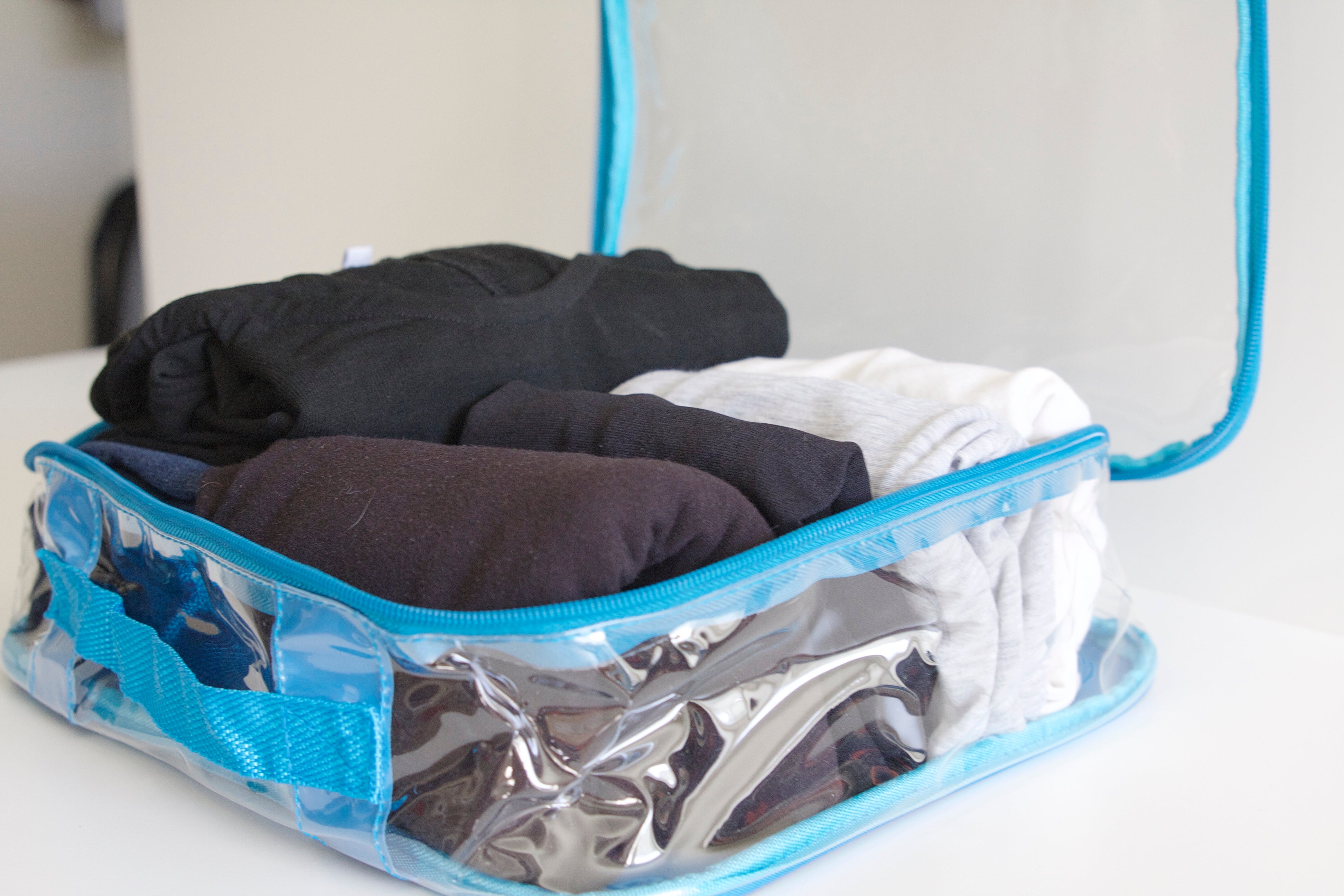 Rolled clothes inside packing cube