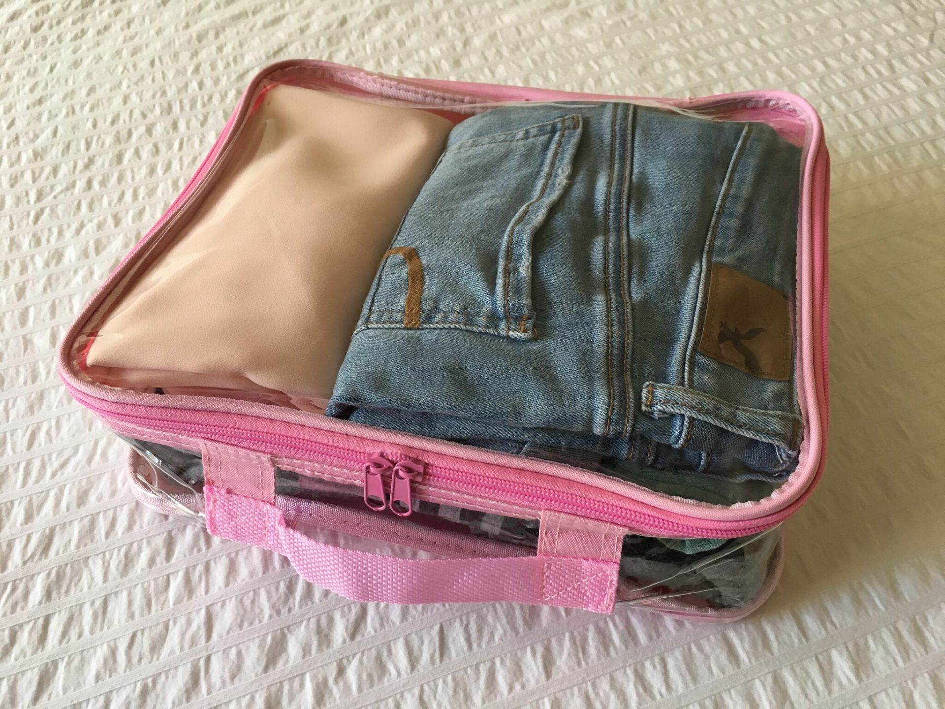 Bulky clothes packed inside a large cube