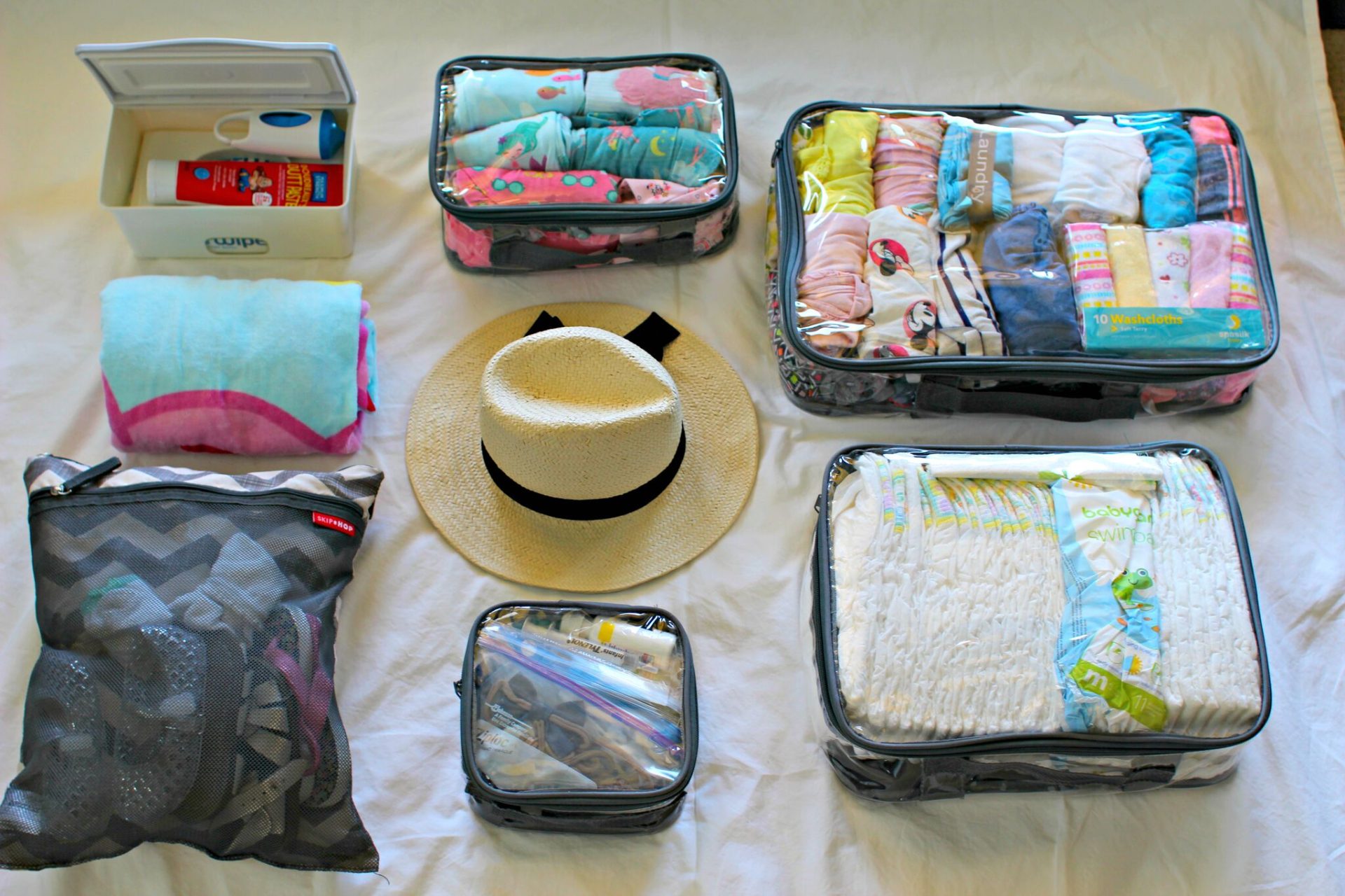 Kid’s travel items organized using packing cubes