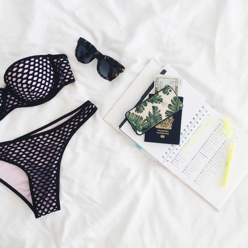 Bikini, smartphone, passport and money for essentials in packing list for a month