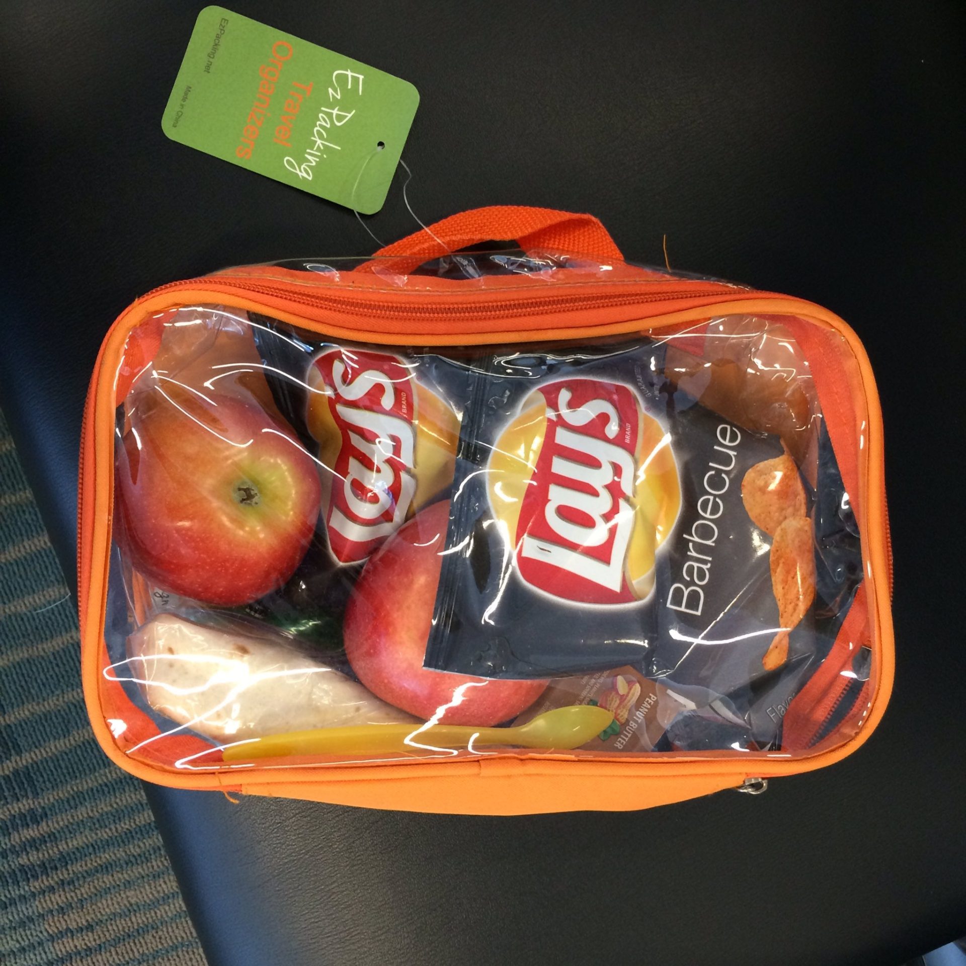 Fruits and chips in an orange small cube