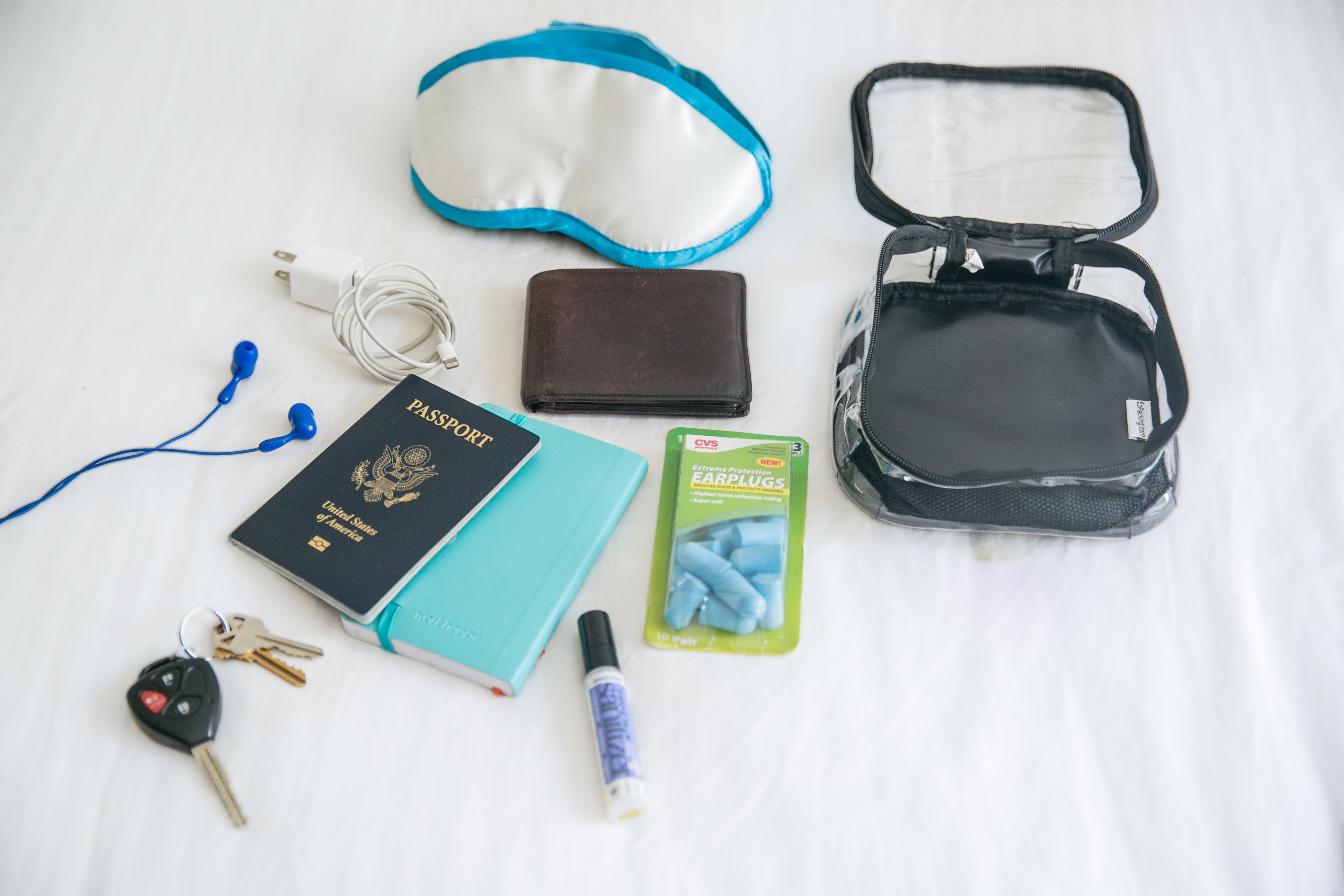 passport and other travel essentials in an extra small cube