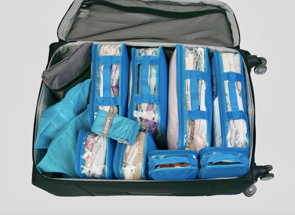 Organized suitcase using blue packing cubes