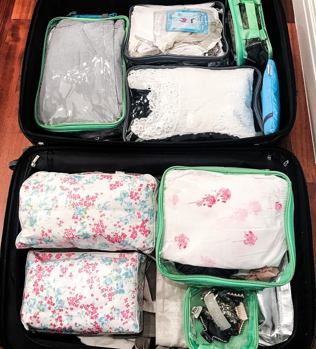 Stacking packing cubes horizontally for organized suitcase