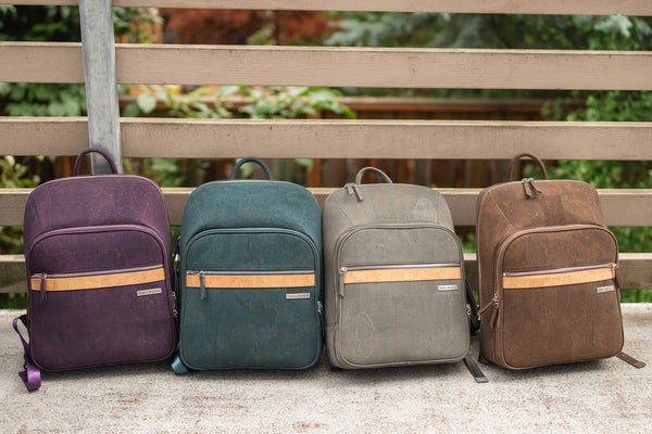 corbett laptop backpacks: purple, teal blue, grey, brown cork