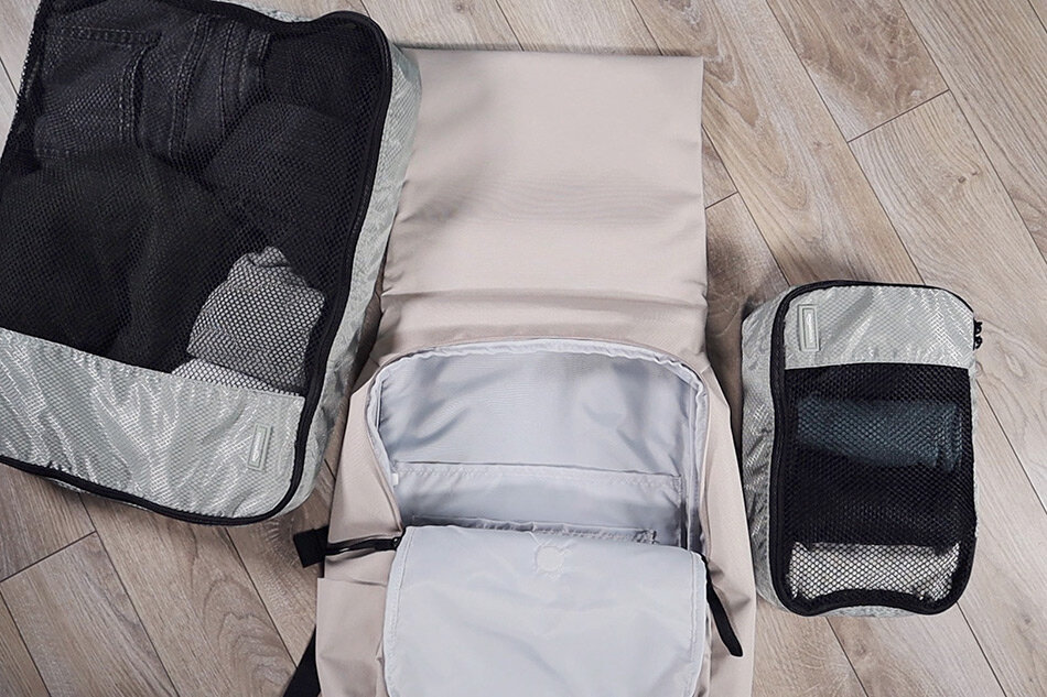 What fits inside the Everlane ReNew Transit backpack: 1 large + 1 small packing cube