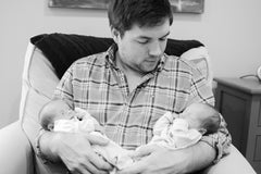 twin boys with father black and white