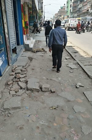 Kathmandu sidewalks require a backpack, not a wheeled suitcase