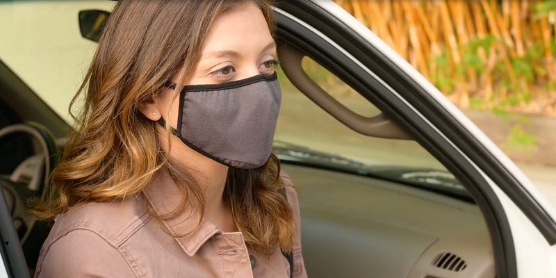 Woman wearing an Allett Face Masks getting out of her car