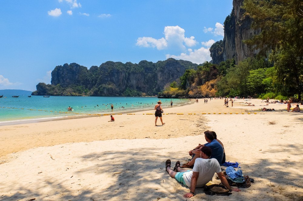 Men sitting on the beach in Thailand