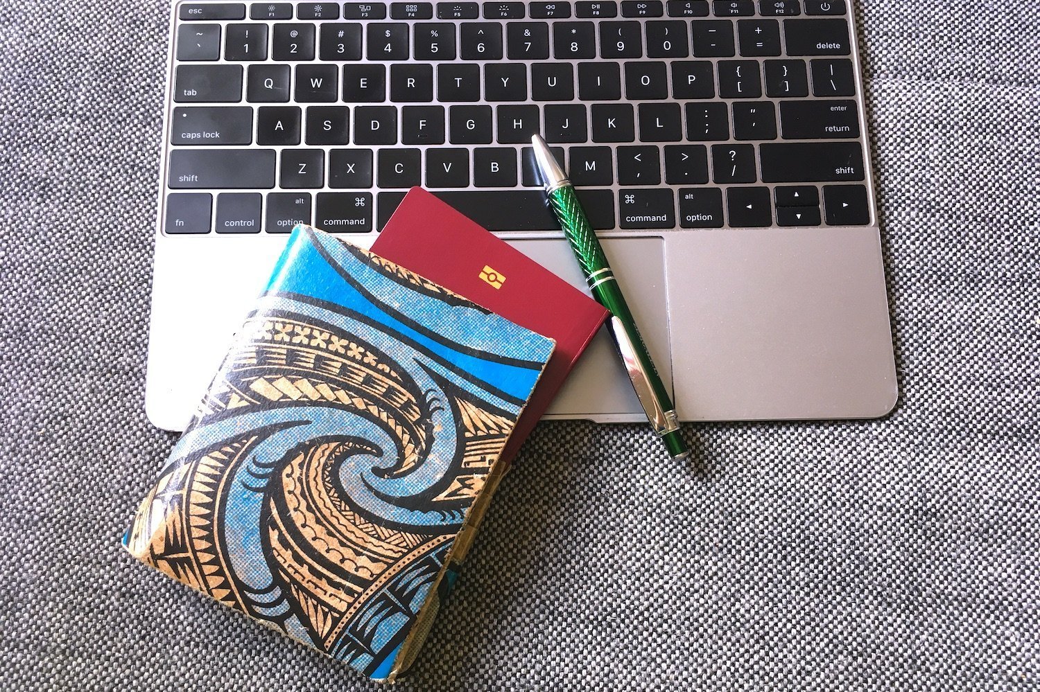 Green Banana Paper Travel Wallet and a Laptop