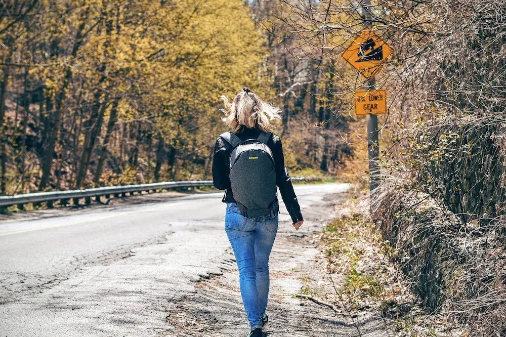 A woman with an anti theft backpack