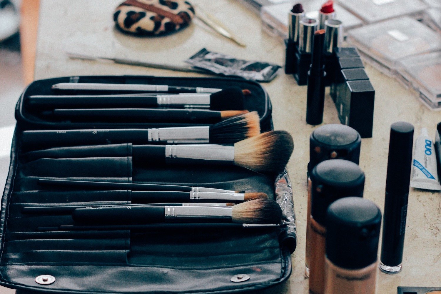 Makeup brushes in a makeup bag