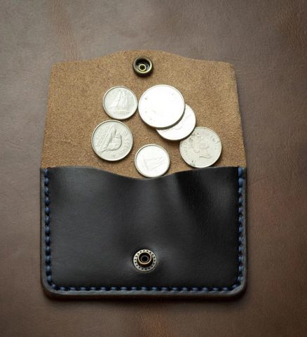 Coins spilling out of a coin wallet