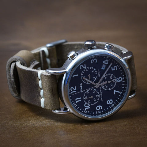 Leather watch strap on a traditional mechanical watch