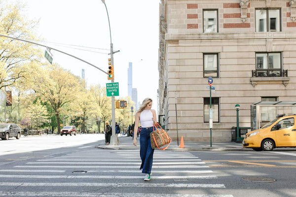 woman carrying a stylish Junyuan Bags
 diaper bag on the streets of New York