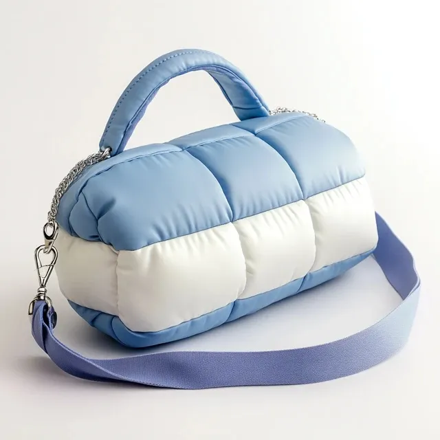 Finished leather handbag showing a smooth, quilted surface typical of a top-grain finish