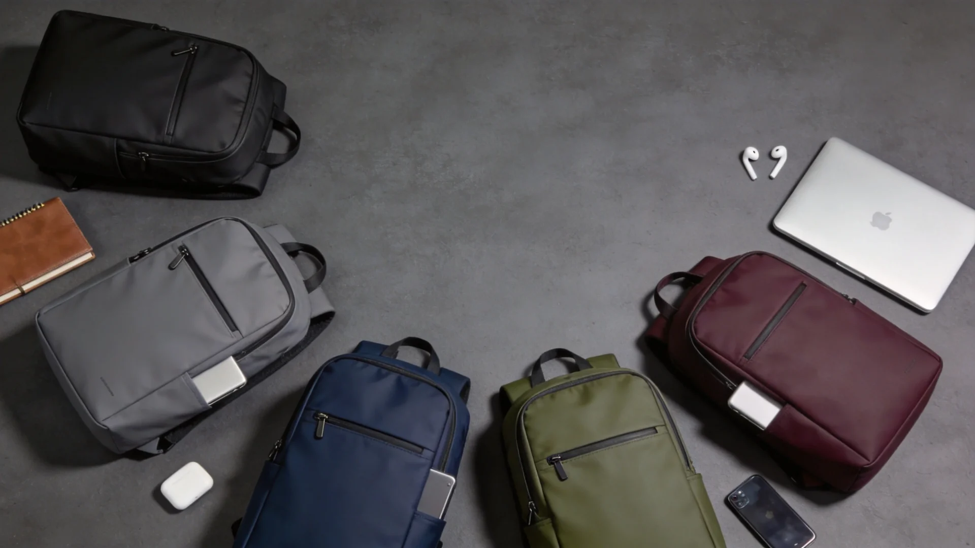 Top Aer Backpack Alternatives Compared Five different minimalist tech commuter backpacks arranged in flat lay product photography