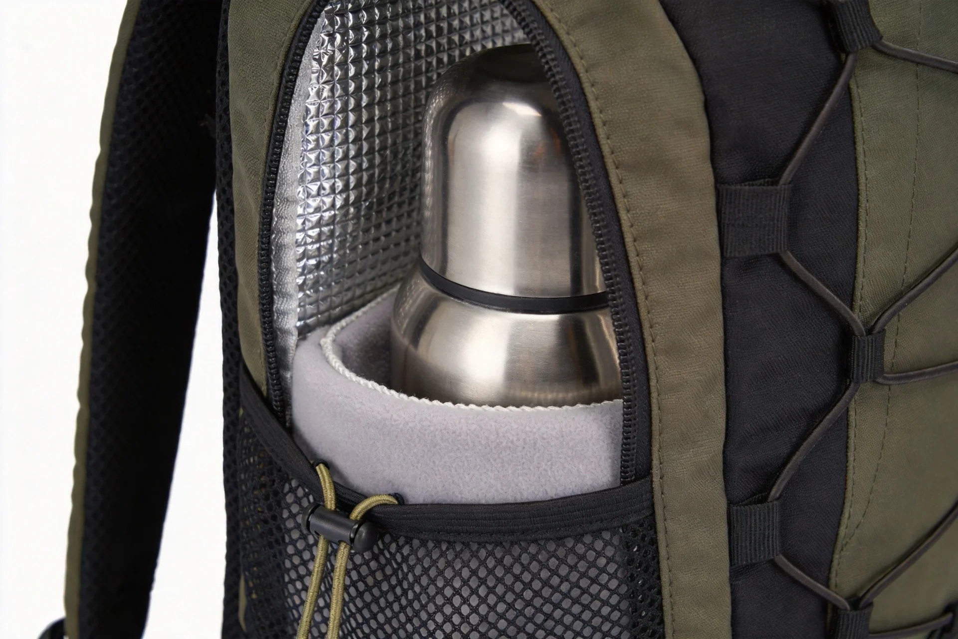 Cross-section close-up of insulated water bottle pocket showing layered construction with nylon shell thermal lining and neoprene padding