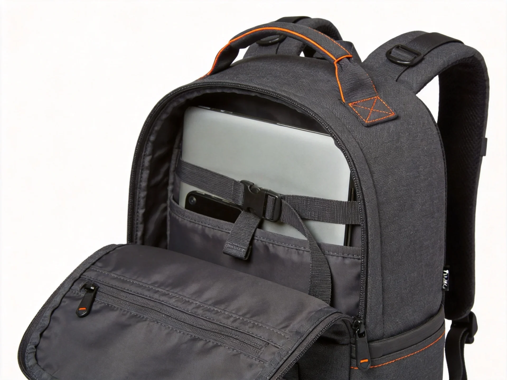Timbuk2 style urban commuter backpack in charcoal gray with orange accent stitching and laptop compartment