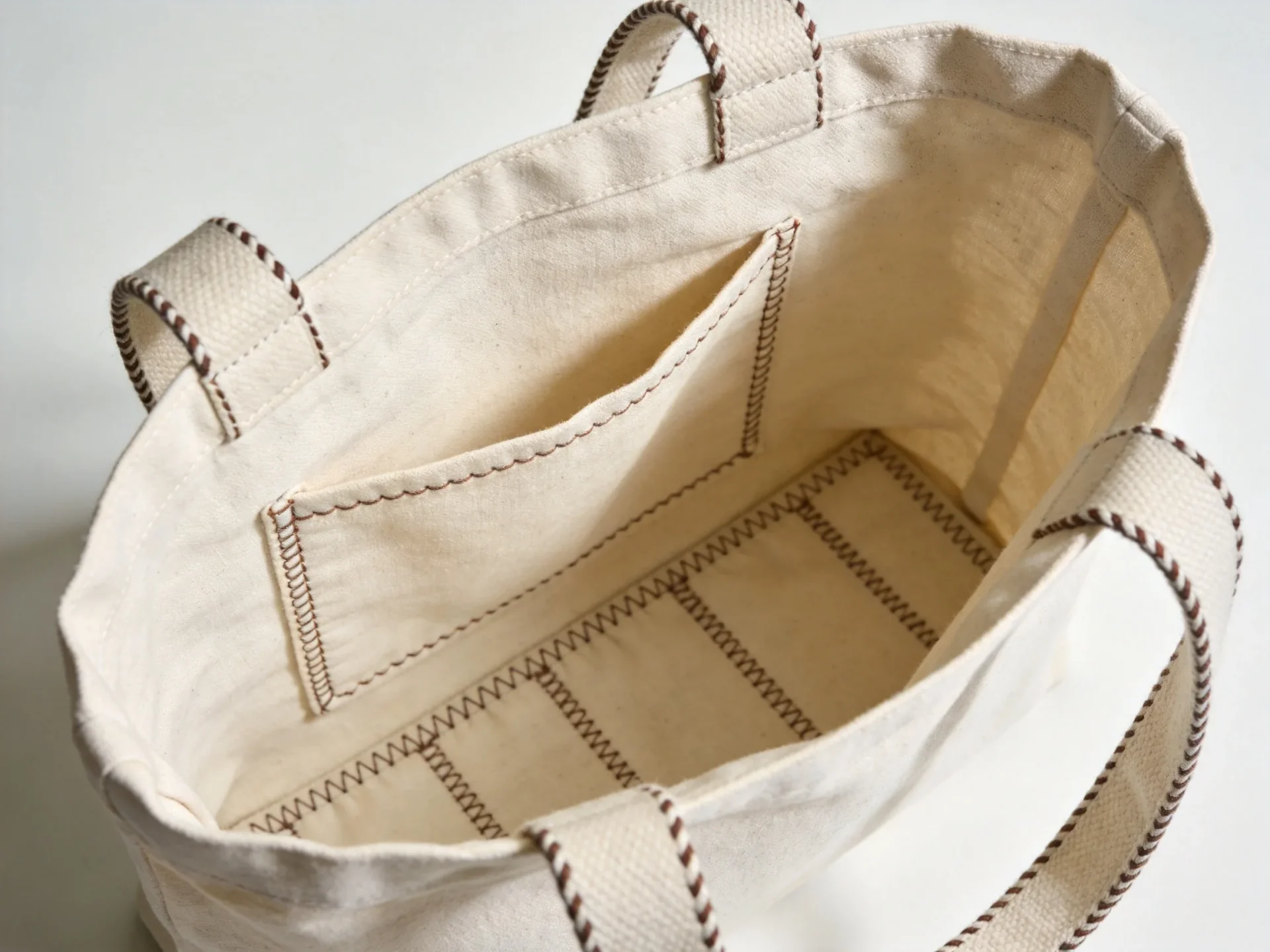 Custom canvas tote bag interior with organized pump and bottle pockets