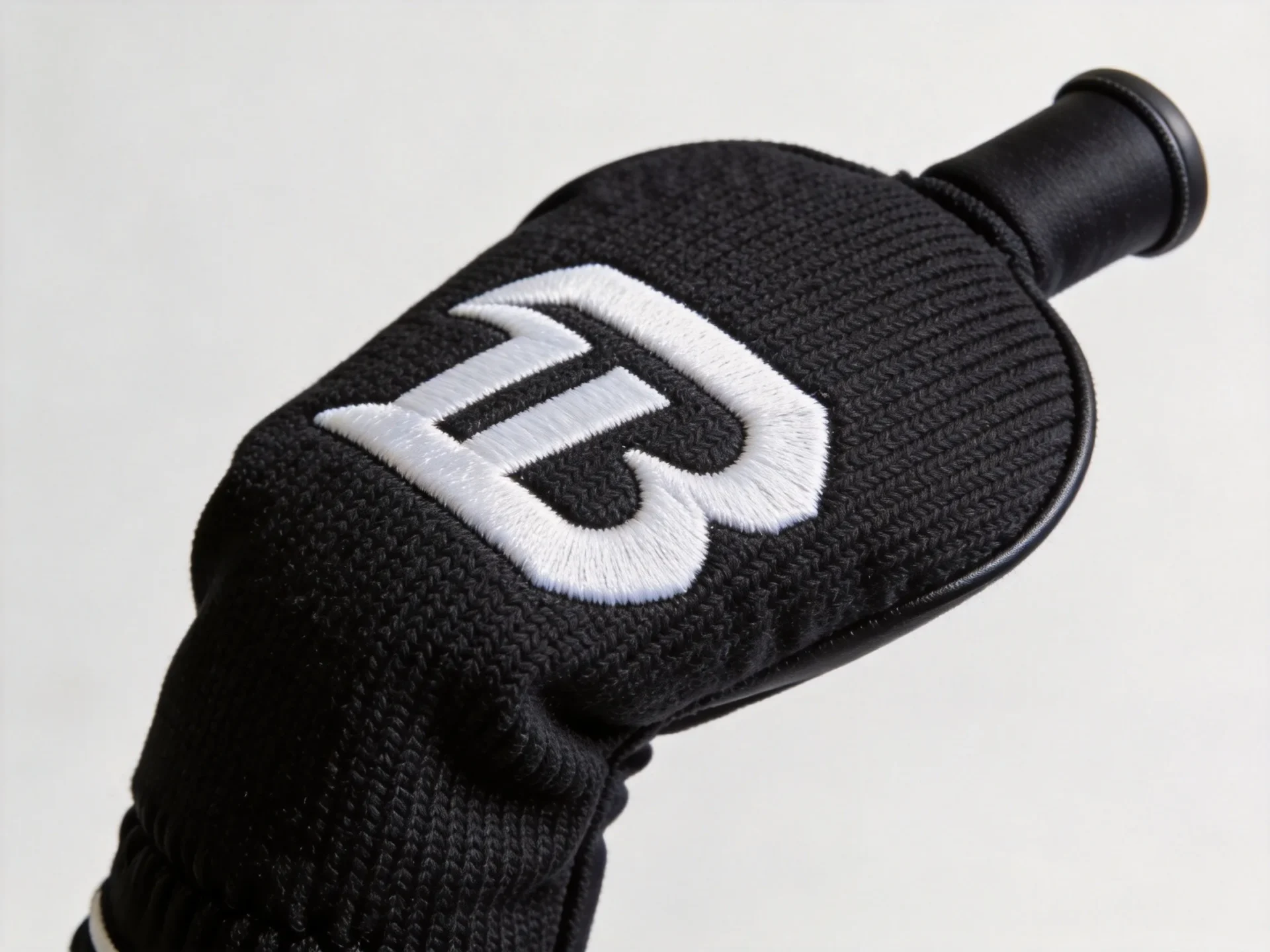 custom golf driver headcover in black knit with embroidered logo