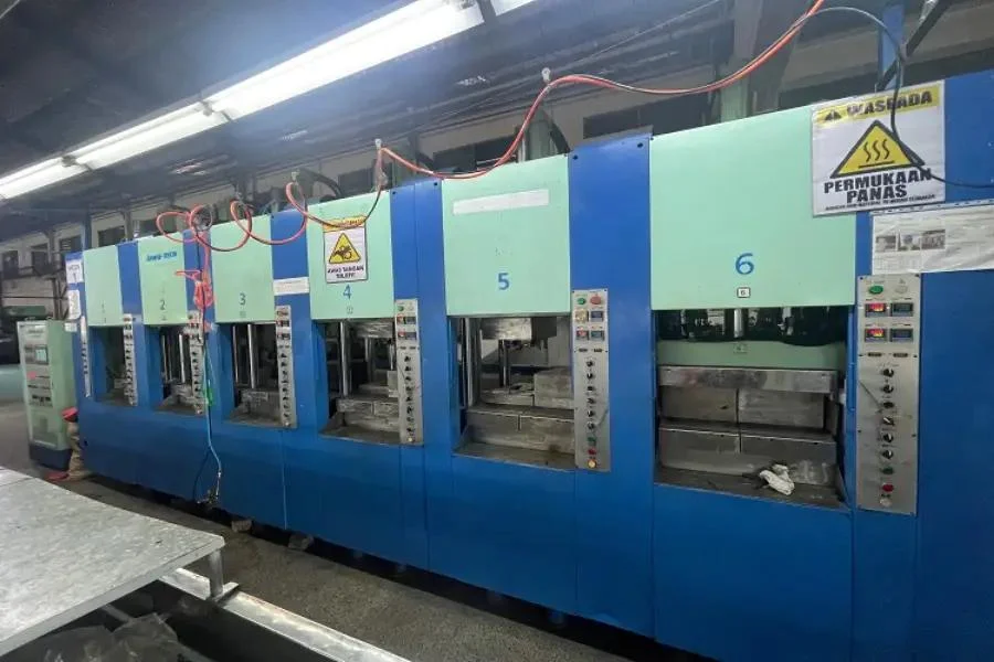 EVA injection molding production line in factory showing industrial molding equipment for rubber tote bag manufacturing