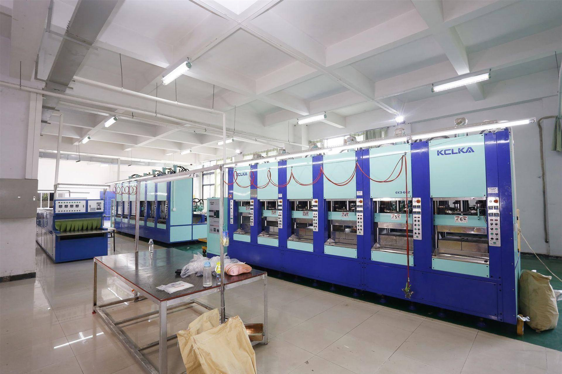 EVA foam bag production line in factory showing injection molding machines producing beach totes at scale