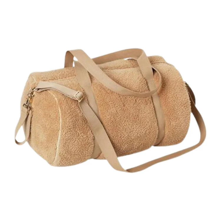 Plush duffle bag showing the webbing shoulder strap, metal adjuster and metal zipper pull